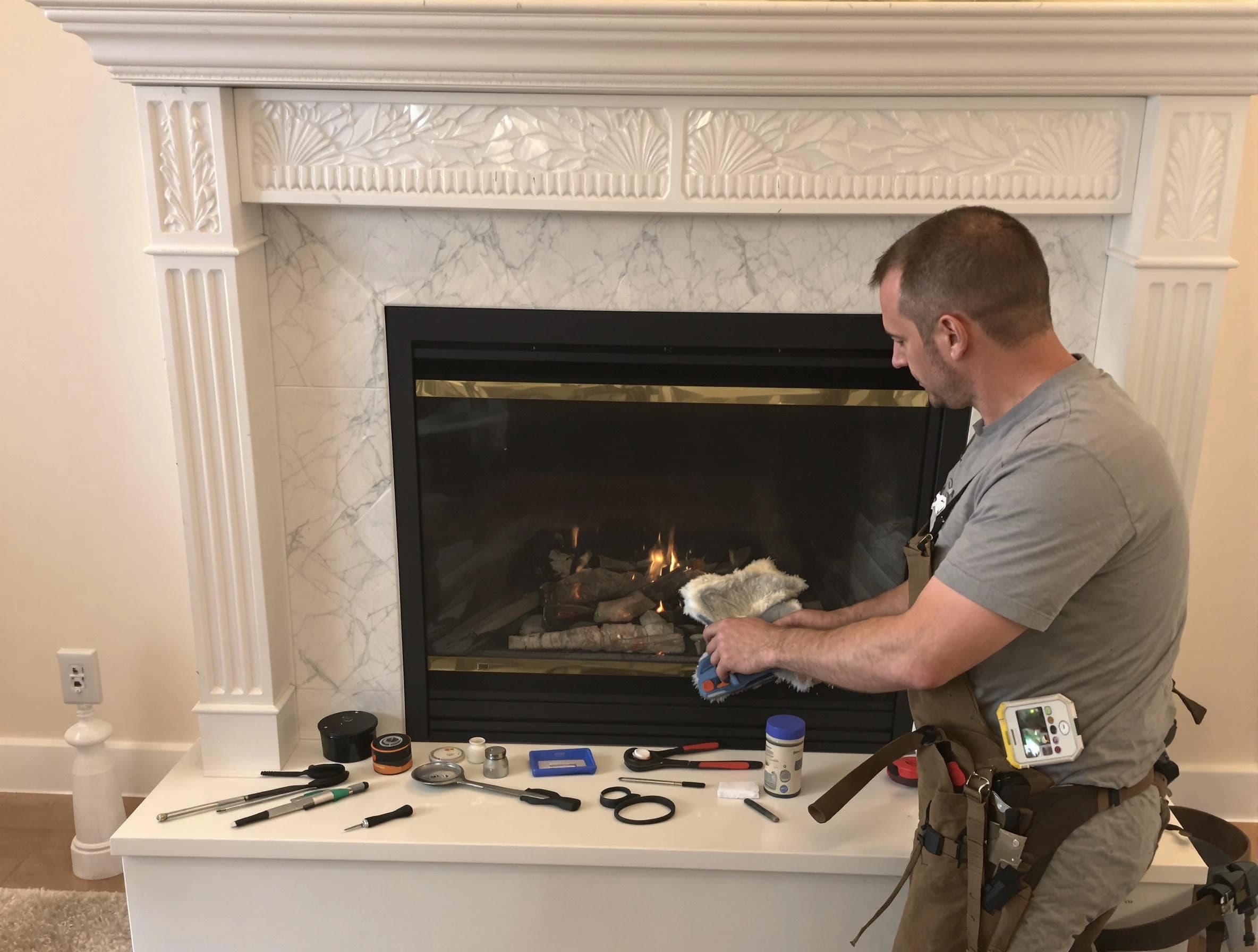 Snellville Chimney Sweep performing fireplace maintenance in Snellville, GA